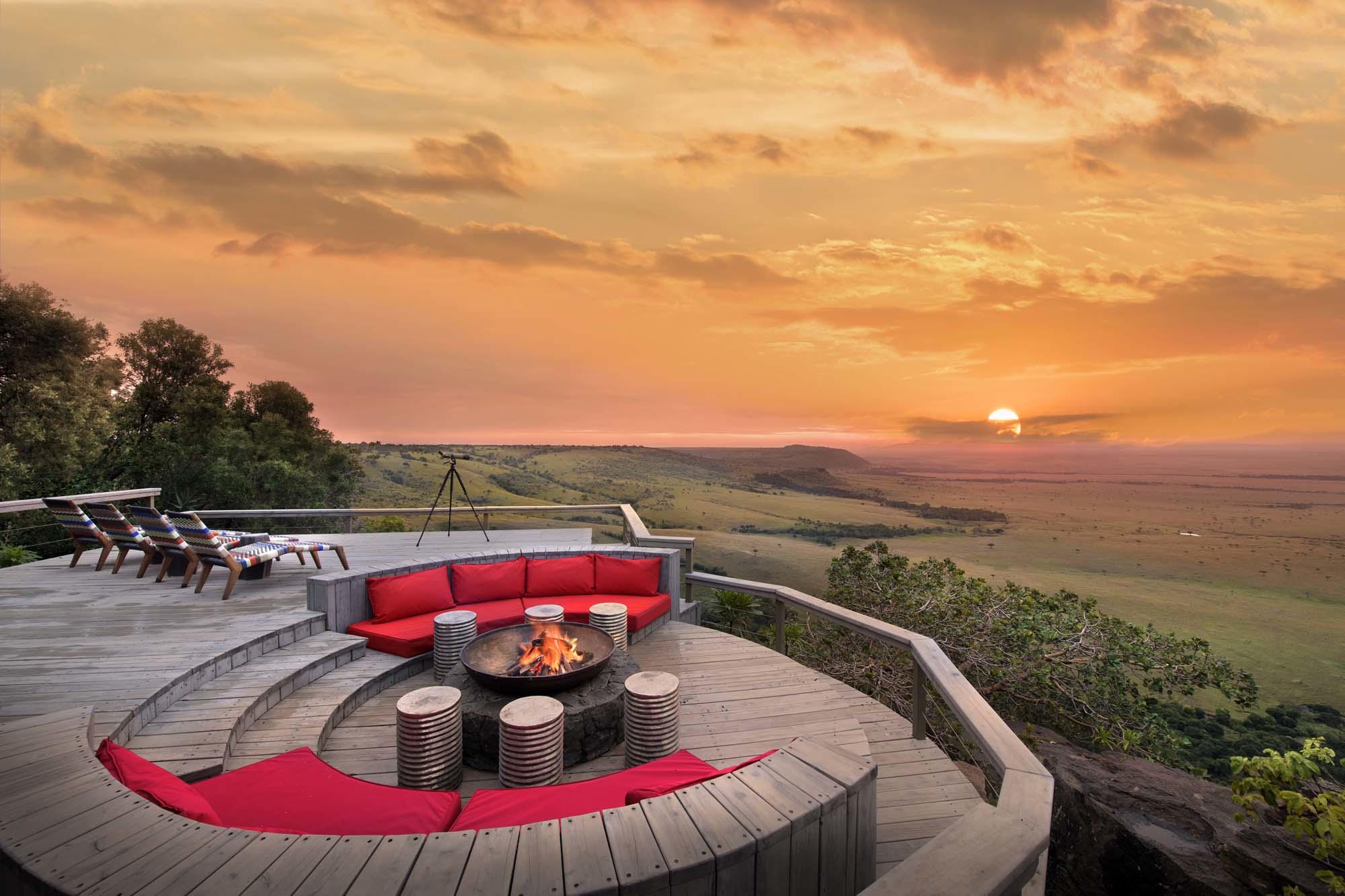 sun setting over deck with firepit at Angama Mara Kenya Masai Mara