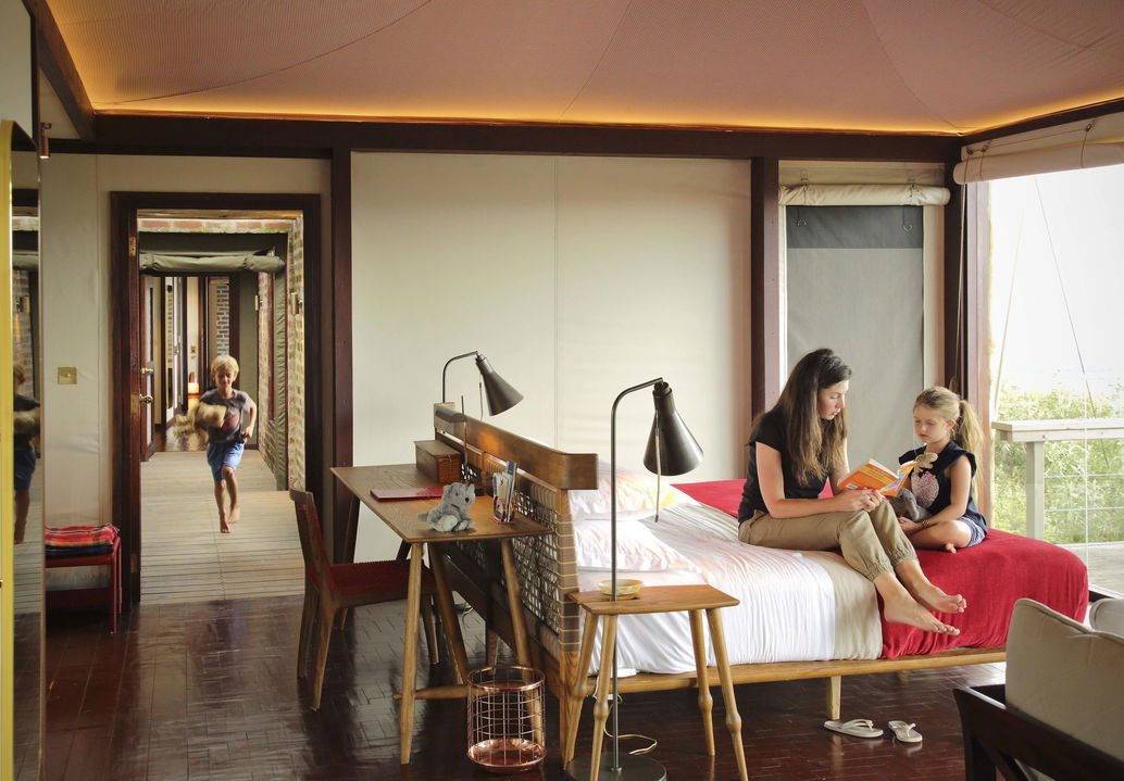 lady guest in the family room with kids at Angama Mara Kenya Masai Mara
