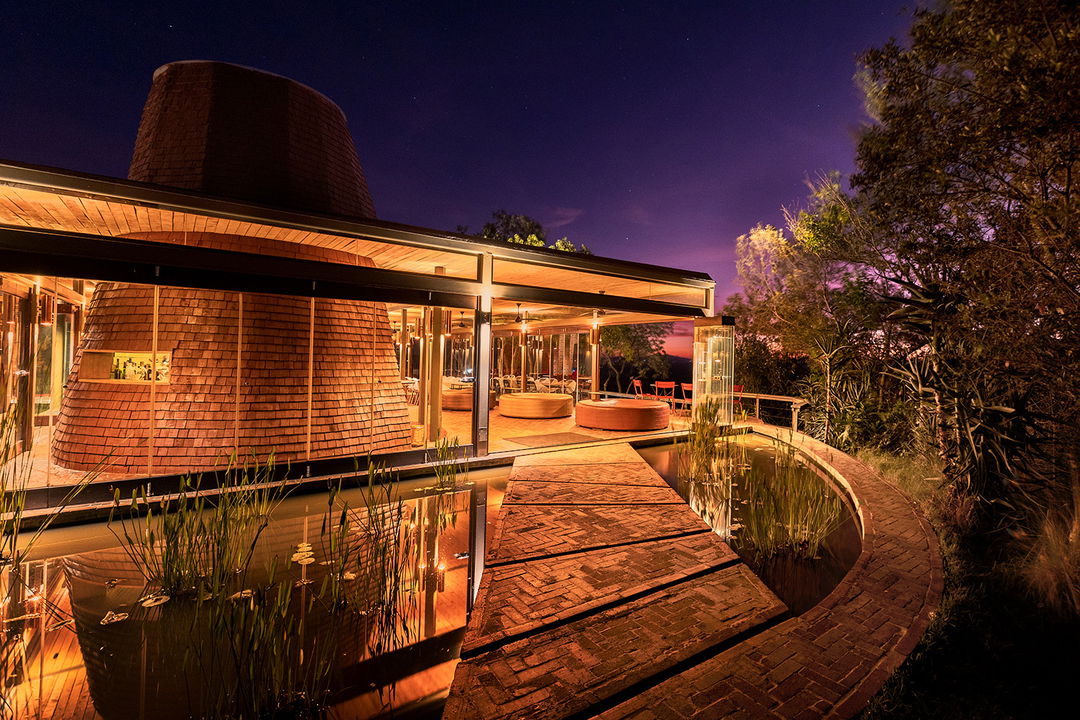 outside illuminated view of the main area of Angama Mara Kenya Masai Mara