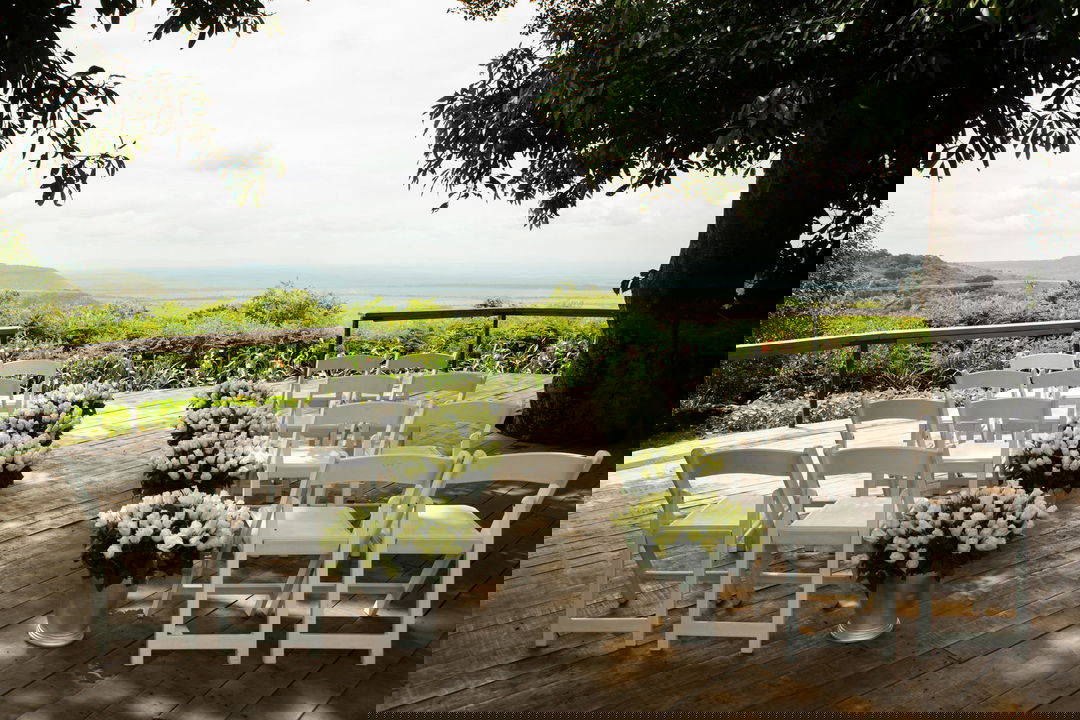 wedding celebration tables on deck by Angama Mara Kenya Masai Mara
