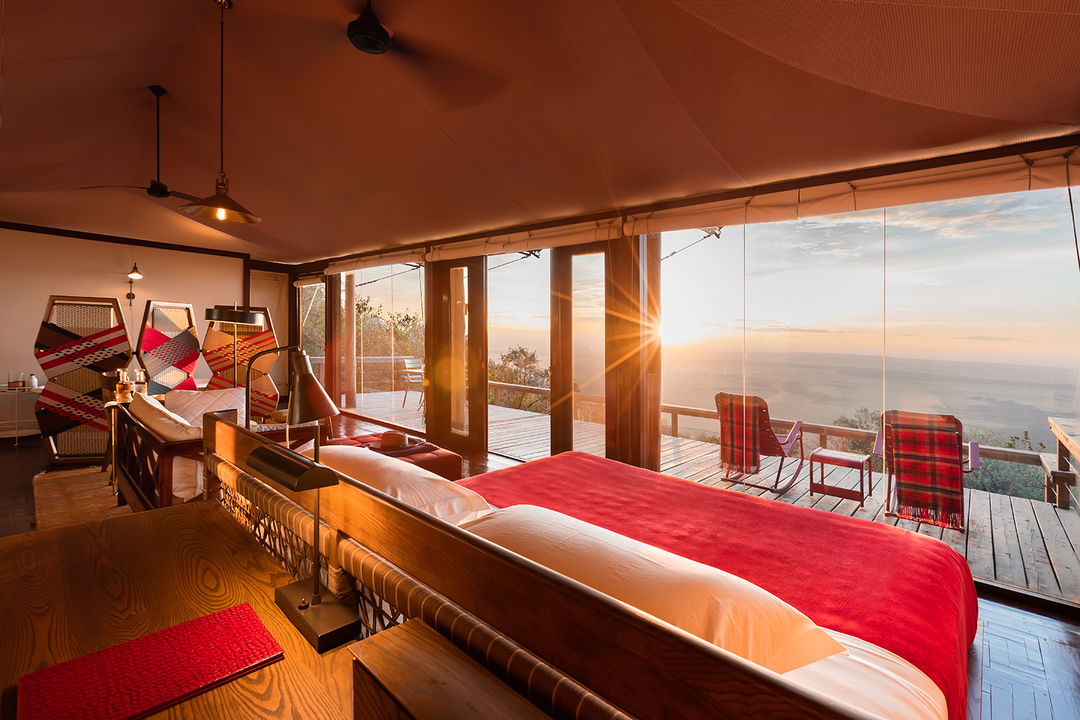 sunset view from inside a bedroom of a tented suite by Angama Mara Kenya Masai Mara