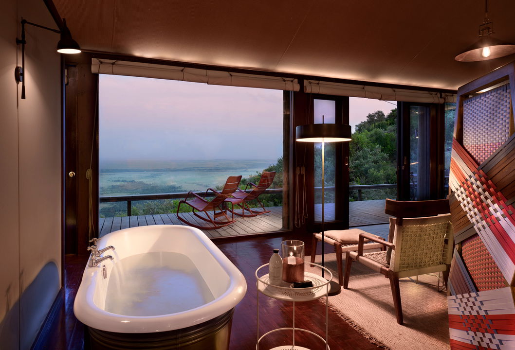 bathtub in bathroom with a view at Angama Mara Kenya Masai Mara