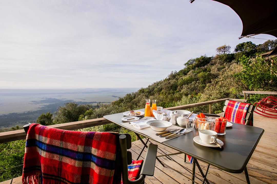 private dining setting on deck of a suite at Angama Mara Kenya Masai Mara