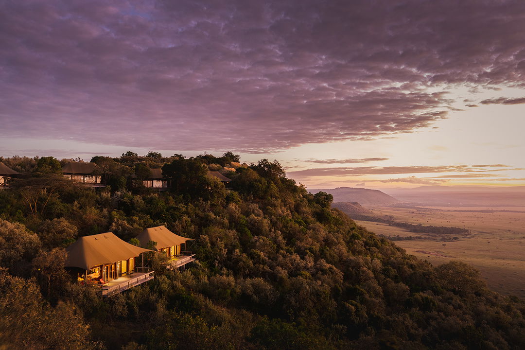 sunset view of tented suites on hill by Angama Mara Kenya Masai Mara