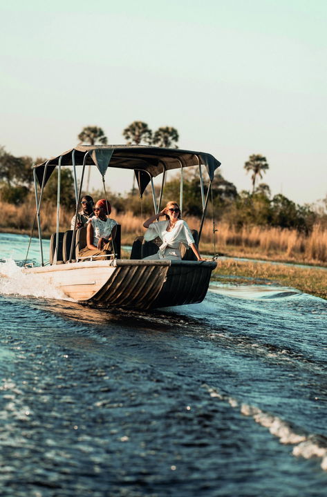 guests on a motorised boat cruise at Belmond Eagle Island Lodge