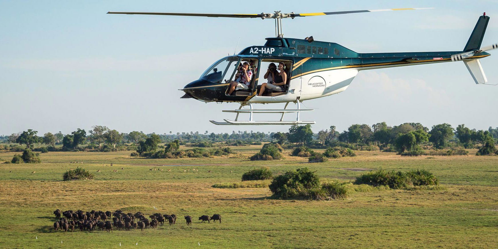 helicopter with guest on a flying activity over Okavango Delta at Eagle island lodge