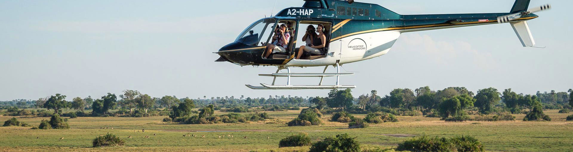 helicopter with guest on a flying activity over Okavango Delta at Eagle island lodge