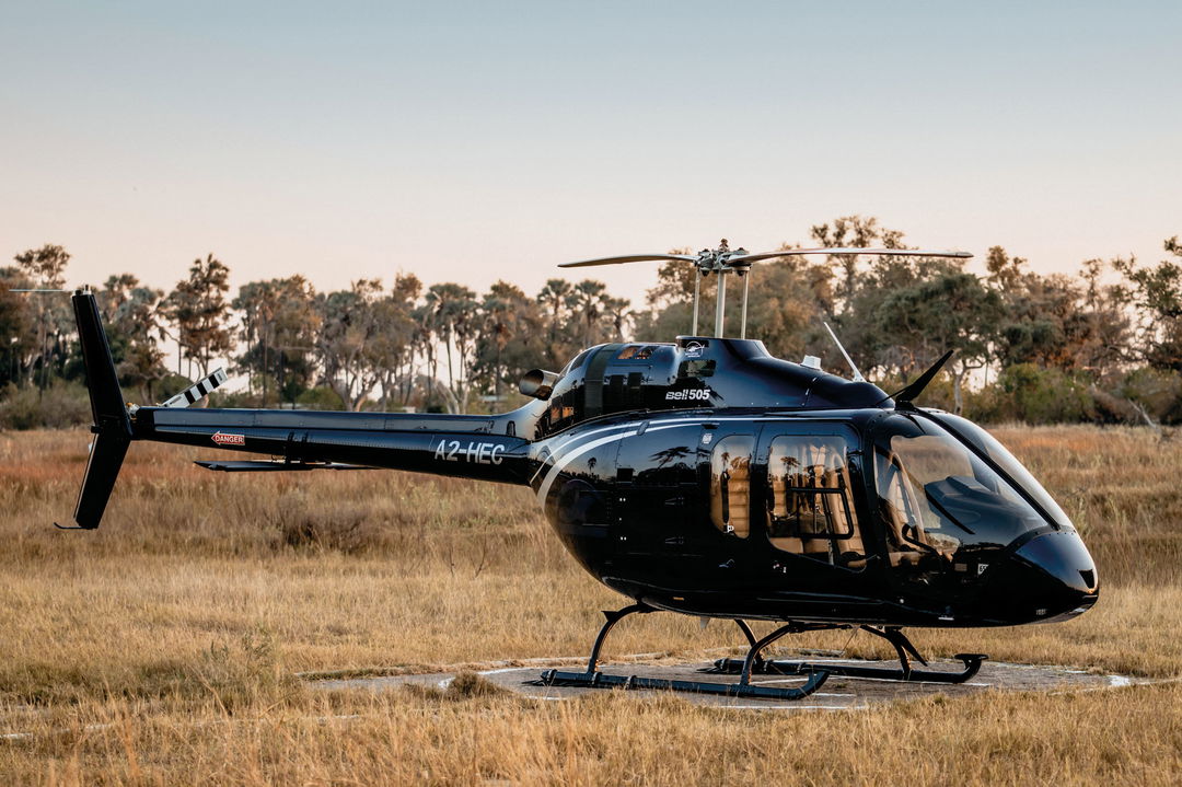 black chopper grounded at Belmond Eagle Island Lodge
