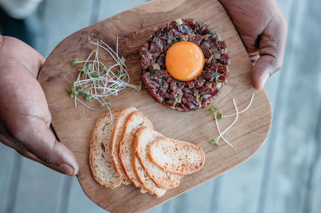food on a wooden plate served at Belmond Eagle Island Lodge
