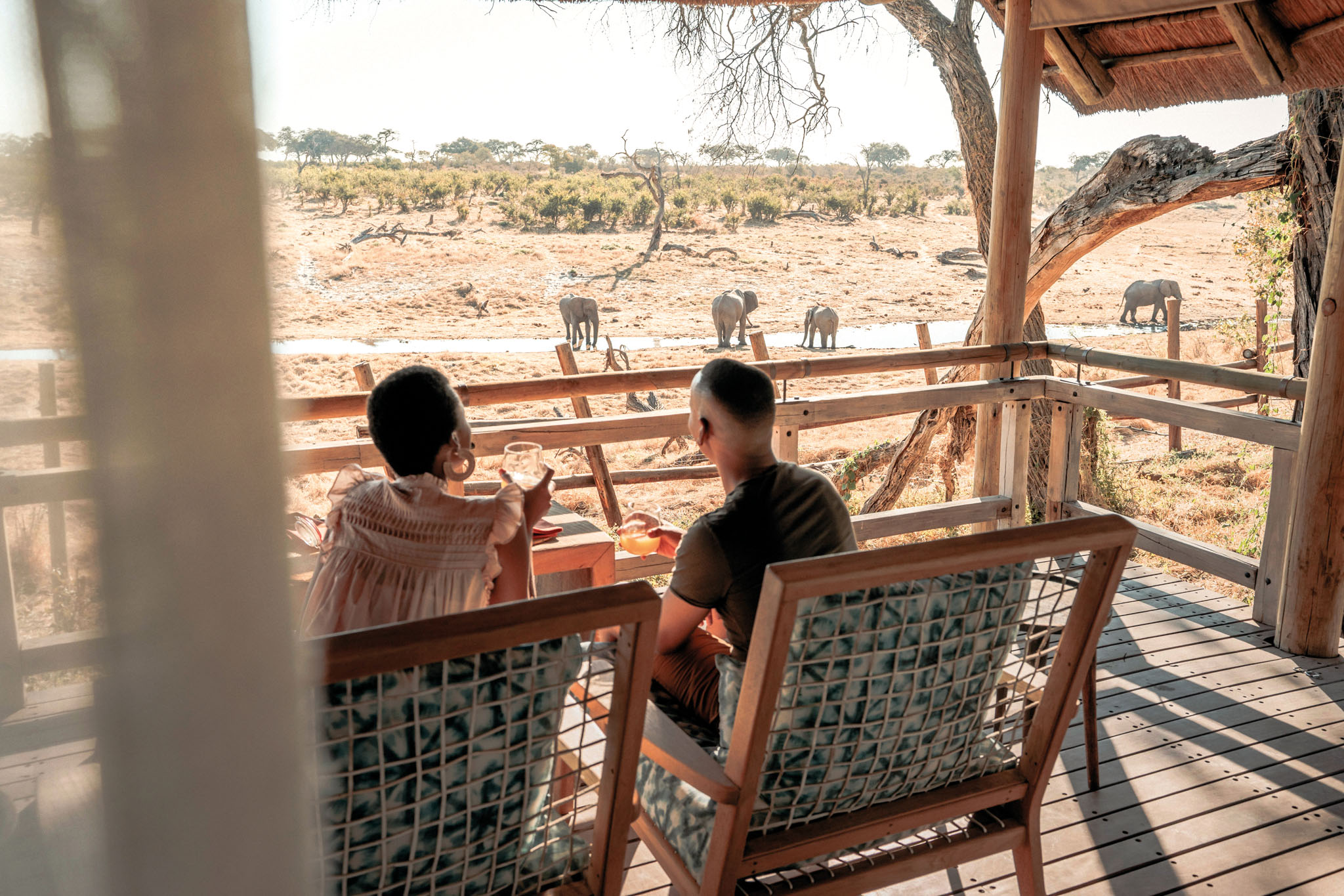 guests sitting on deck at savute elephant lodge