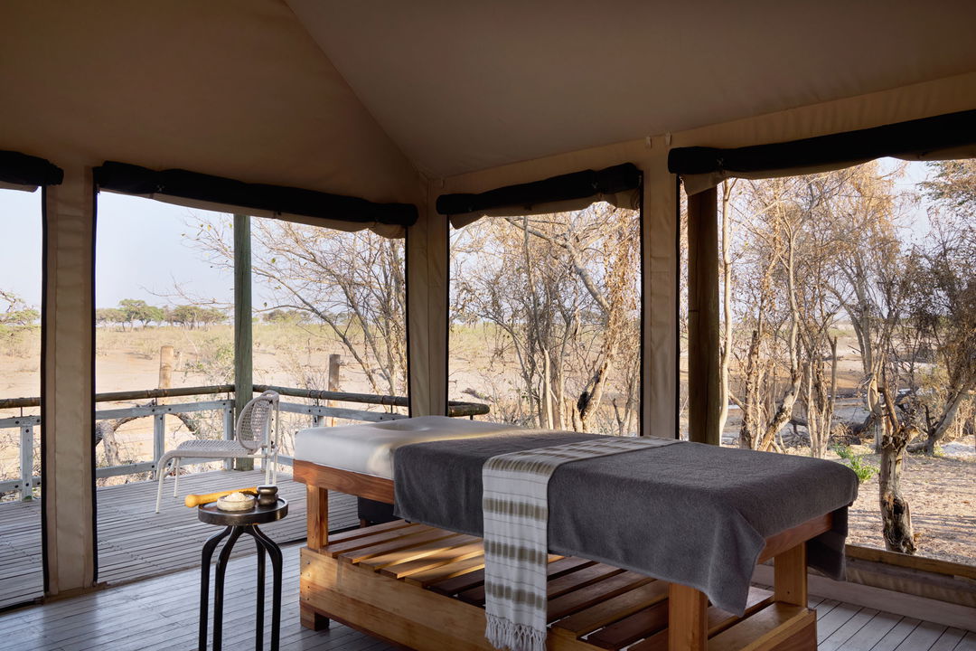  spa bed on wood deck at Savute elephant lodge overlooking the plains