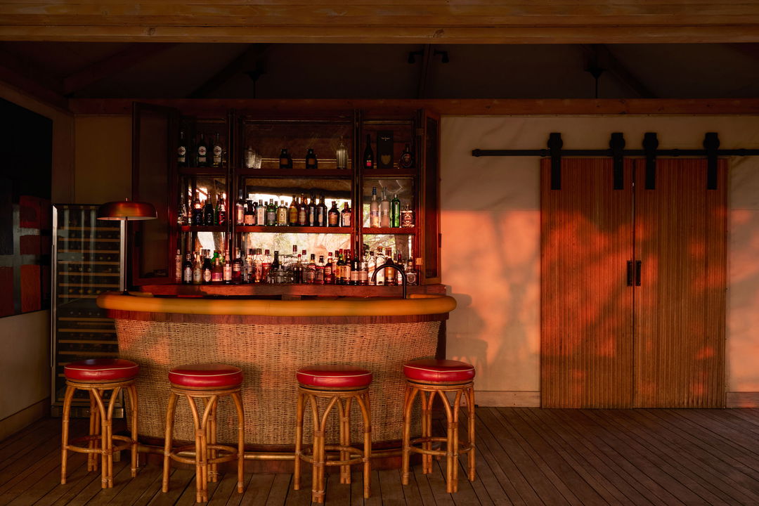 view of bar chairs at counter by Belmond Safaris Savute Elephant lodge Botswana