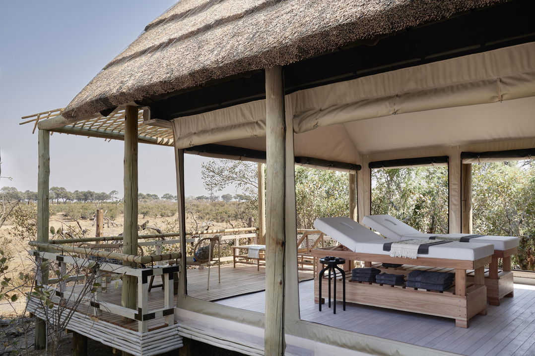 two spa beds on balcony with view of Okavango delta at Belmond Savute Elephant lodge