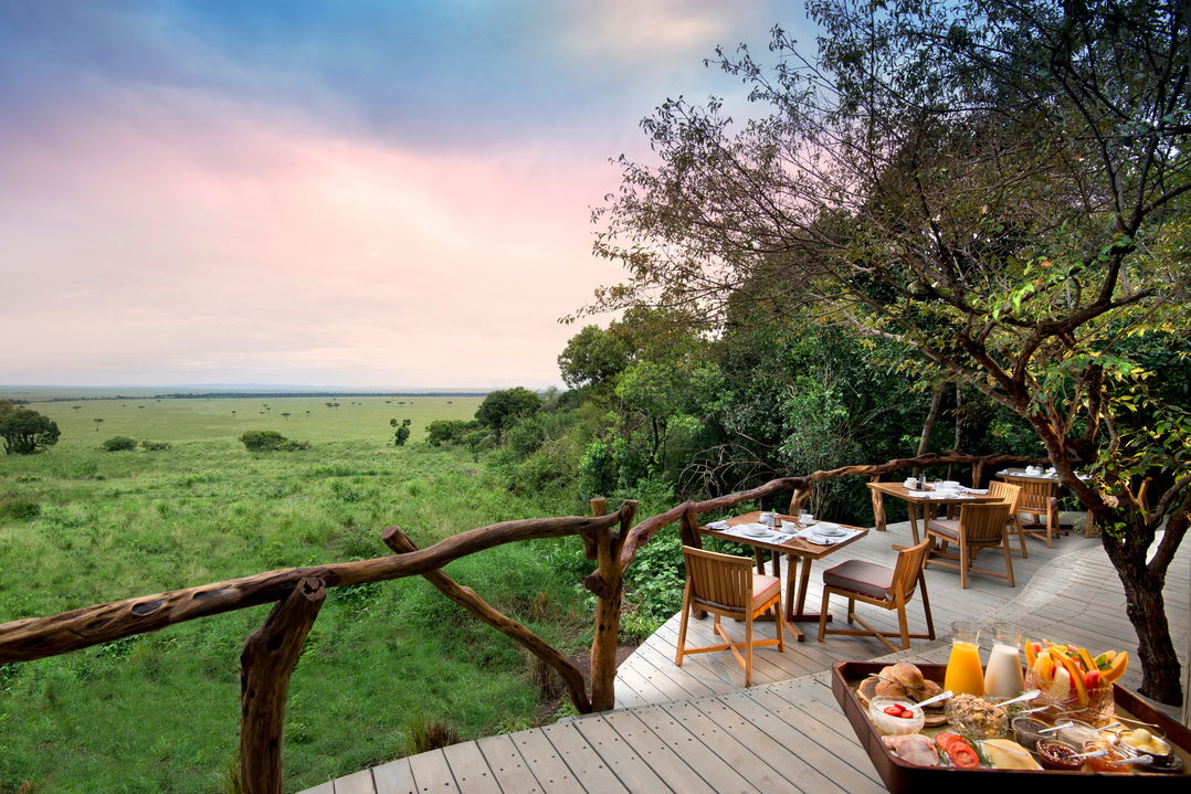 private breakfast setting on viewing deck of andbeyond Bateleur camp Kenya Masai Mara