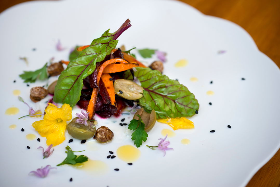 gourmet food plated on a white pate by andbeyond Bateleur camp Kenya Masai Mara