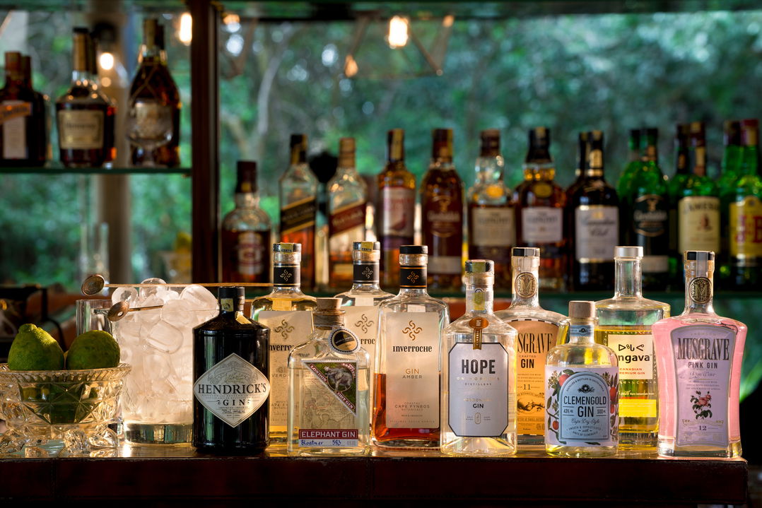 liquor bottles in the bar facility of andbeyond Bateleur camp Kenya Masai Mara