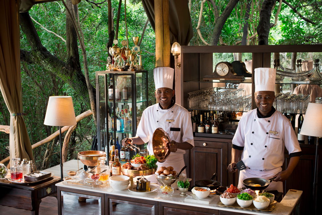 chefs at carvery table of andbeyond Bateleur camp Kenya Masai Mara