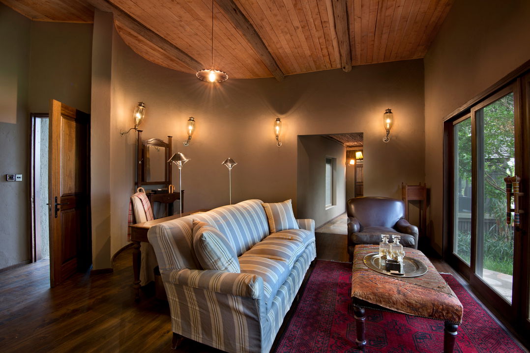 couch in viewing lounge of suite by andbeyond Bateleur camp Kenya Masai Mara