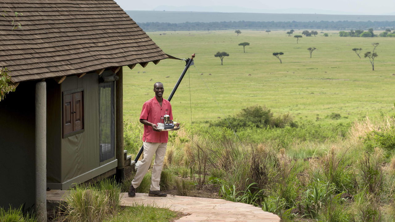 butler servicing a suite at andbeyond Bateleur camp Kenya Masai Mara