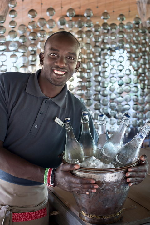 water bottles in ice bowl for guests of andBeyond Kichwa Tembo Camp Kenya Masai Mara