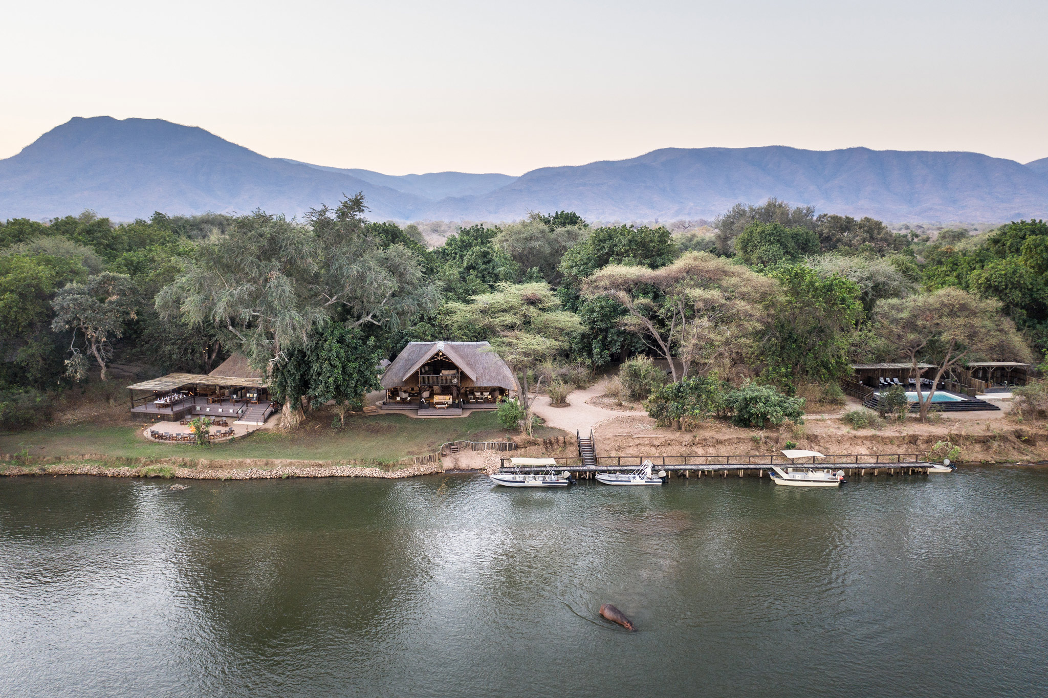 view of lodge on riverbank in zambia chiawa safaris