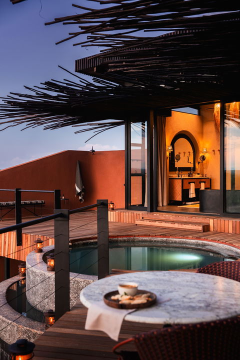 deck of vista suite looking out over plains at sunset by Chichele Presidential Lodge Zambia