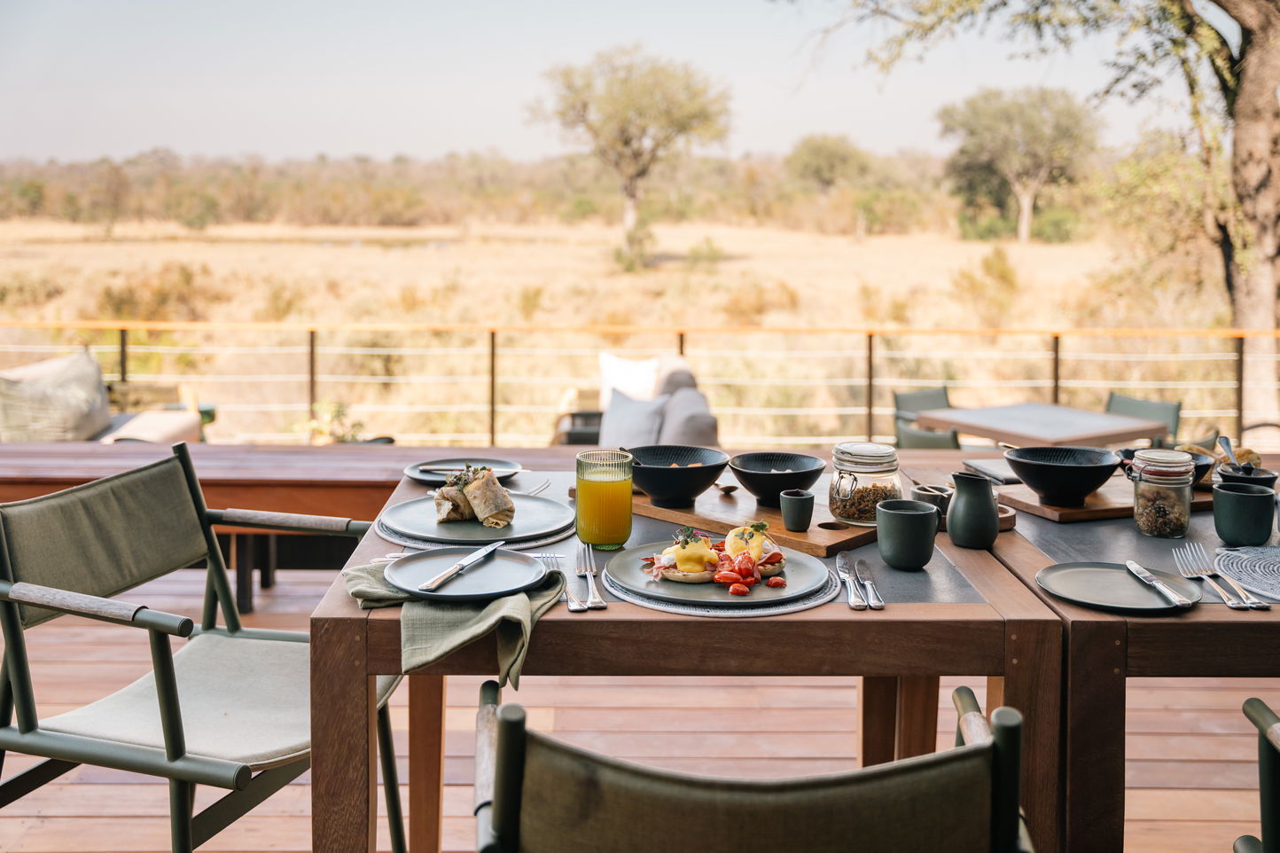table set for breakfast overlooking savanna at Simbambili lodge in Thornybush reserve