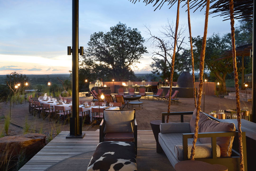 deck ready for supper at sunset by Chichele Presidential Camp Zambia