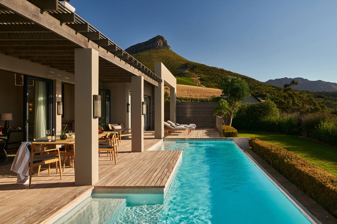 main villa pool area with loungers at Delaire Graff luxury Wine estate in Franshoek