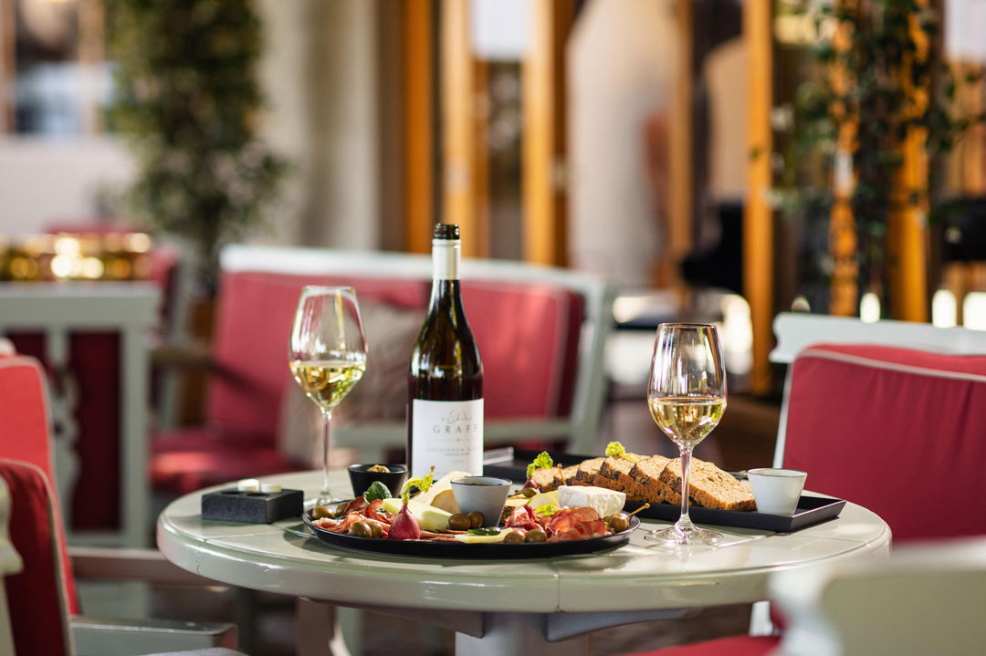 table set with snack and wine at Delaire Graff luxury Wine estate in Franshoek