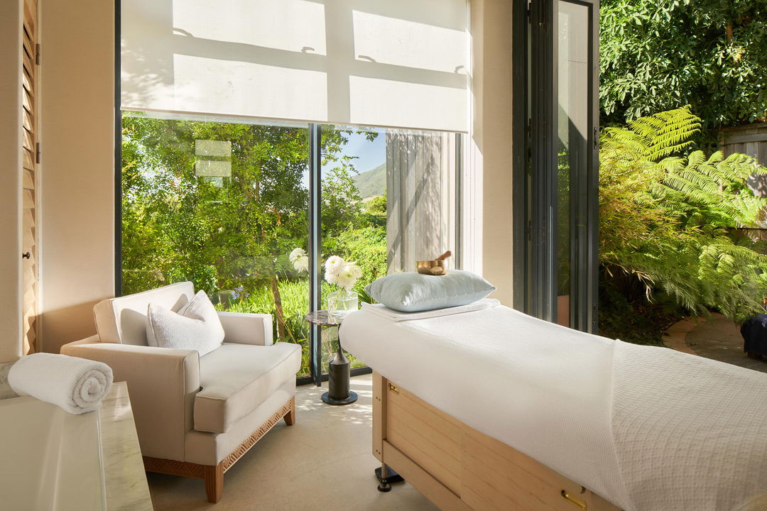 white spa bed and chair with views from the wellness centre Delaire Graff luxury Wine estate in Franshoek