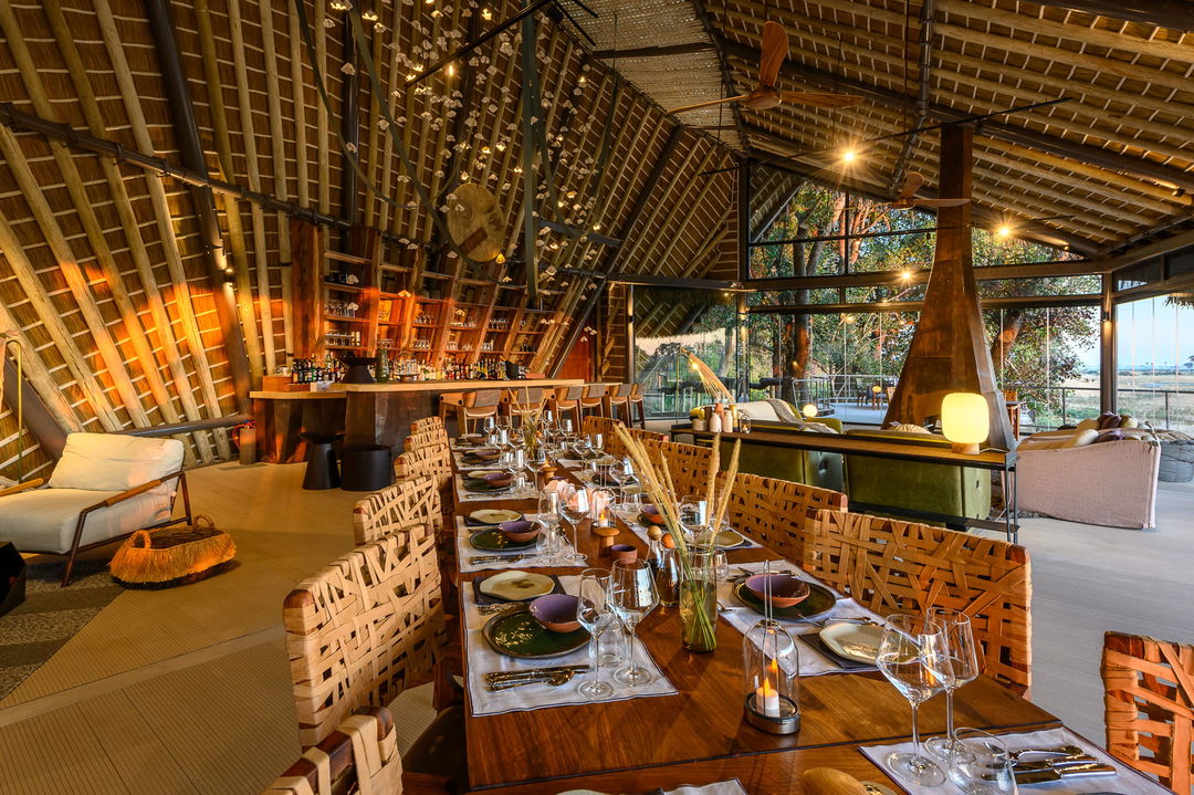 dinner table set for guests in main dining lounge of Jao Camp Botswana