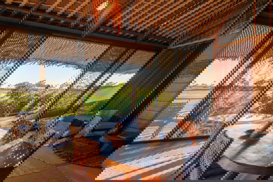 interior view of luxury suite with deck and splash pool outside at Jao Camp Wilderness Okavango Delta Botswana