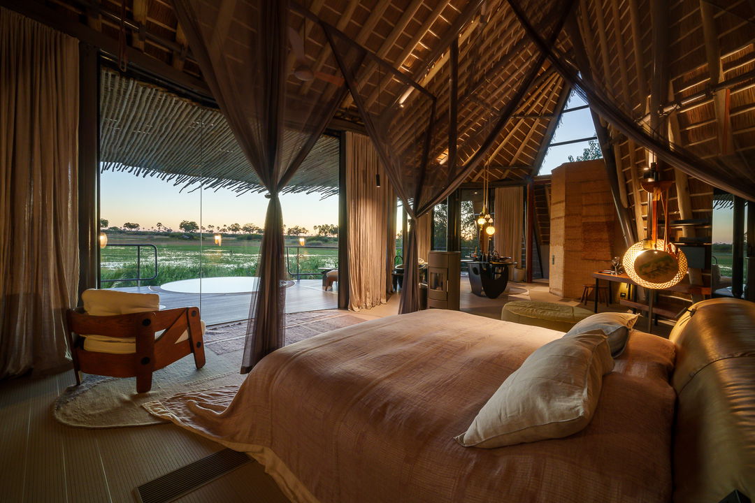 double bed in room with view on delta at Jao Camp Botswana
