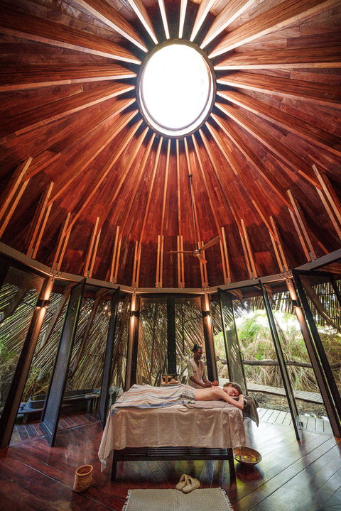 guest in spa on bed getting a treatment at Jao Camp Wilderness Botswana