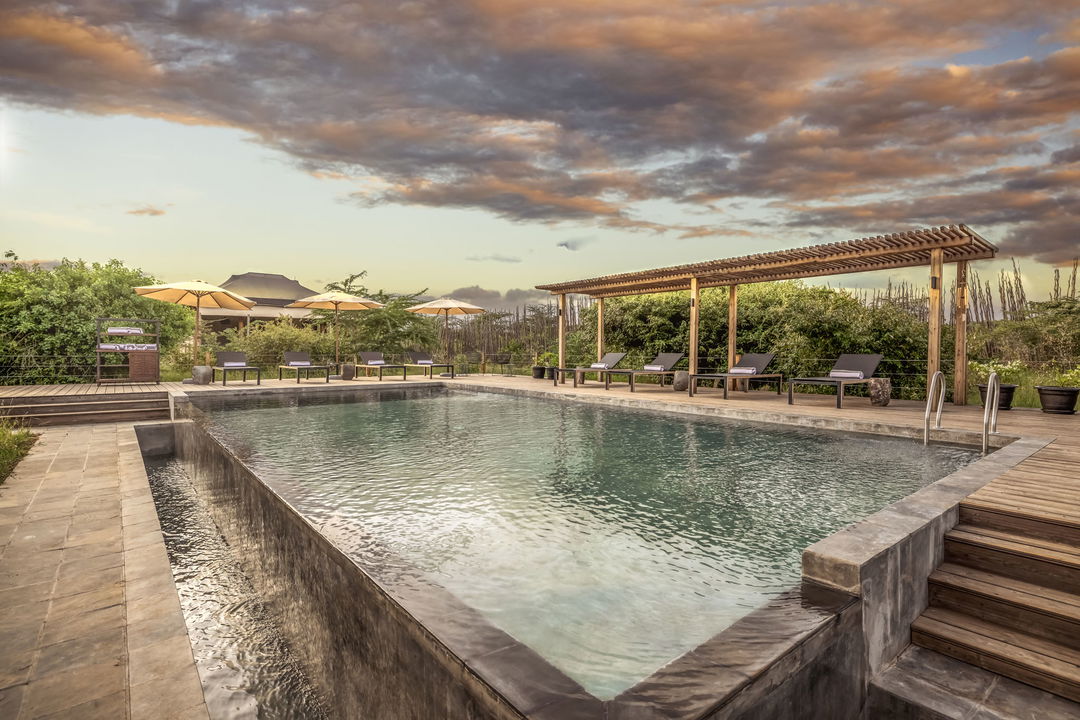 ai generated image of the artist impression of the pool at the JW Marriot Masai Mara Kenya