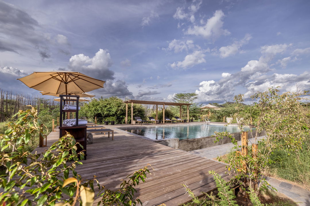 deck and sala with loungers at main pool of the JW Marriot Masai Mara Kenya