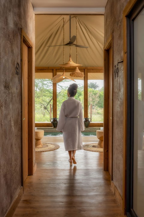 lady guest walking in spa of the JW Marriot Masai Mara Kenya