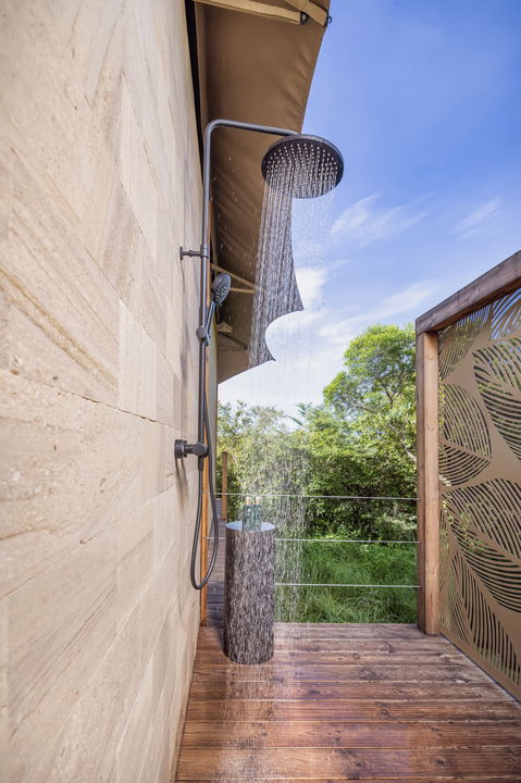 outdoor shower at a king suite of the JW Marriot Masai Mara Kenya
