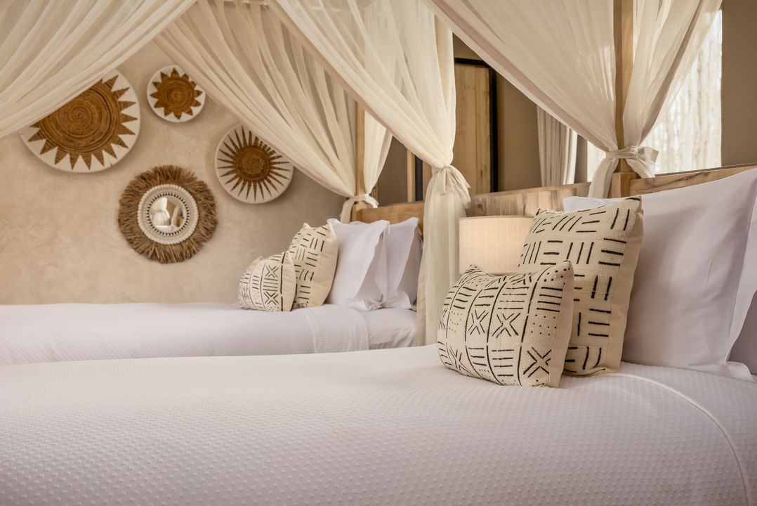 view of the beds in a twin room of the JW Marriot Masai Mara Kenya