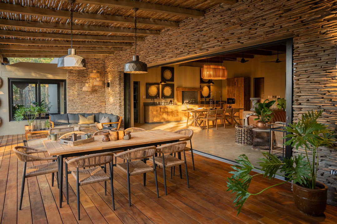 dining area on deck with tables and chairs at Kamara house Thornybush