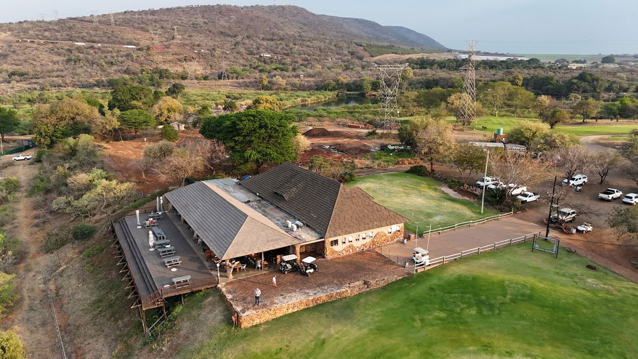 drone shot of Kambaku golf course clubhouse next to crocodile river