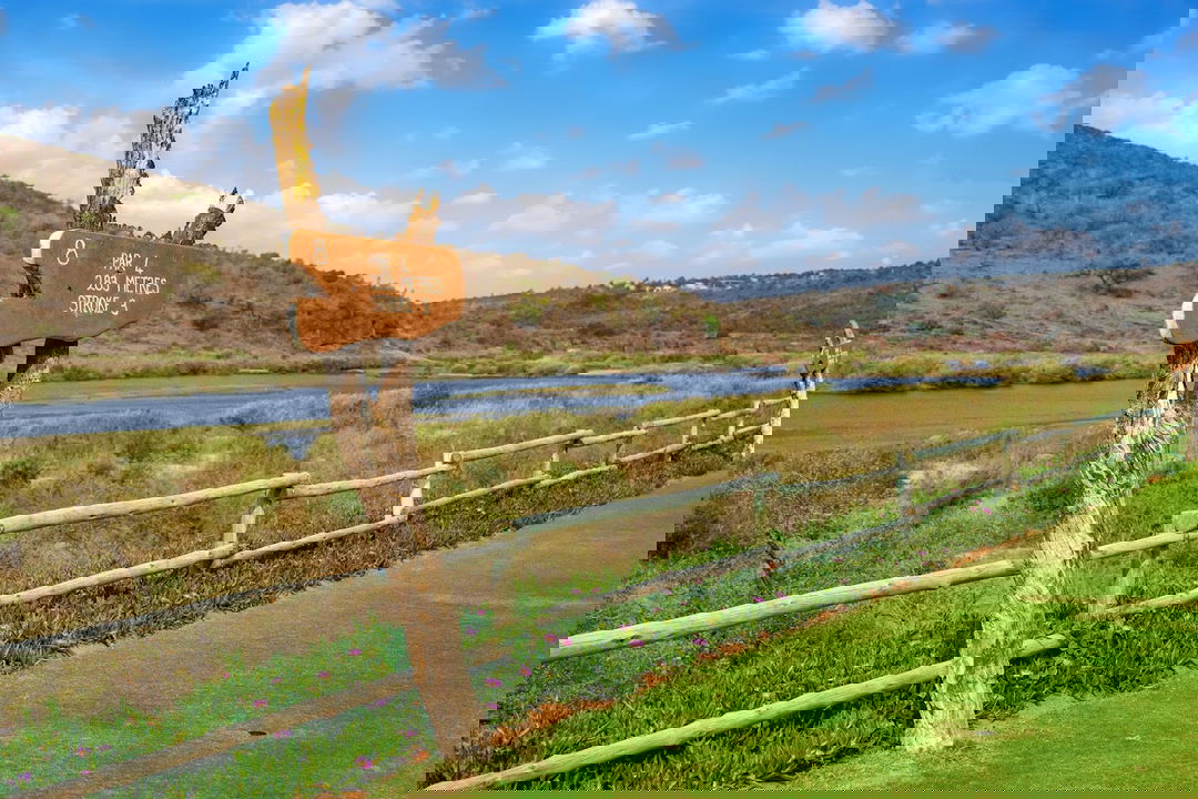 view of hole next to river at Kambaku golf course