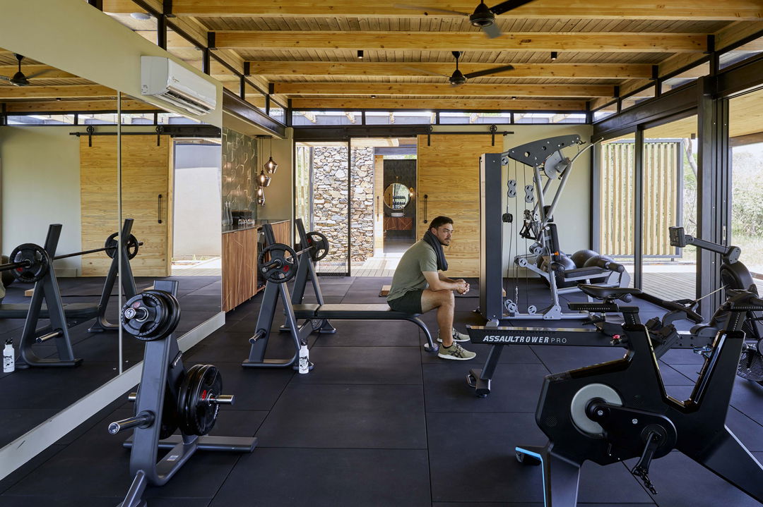 guest in gym of lion sands ivory lodge