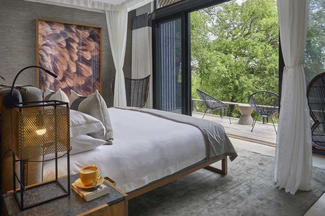 interior view of suite bedroom by Ivory lodge Lion Sands