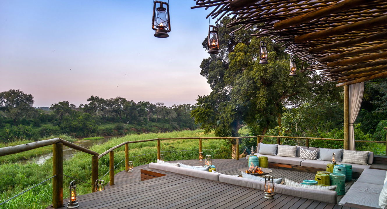 deck lounge area with river view at Narina lodge lion Sands