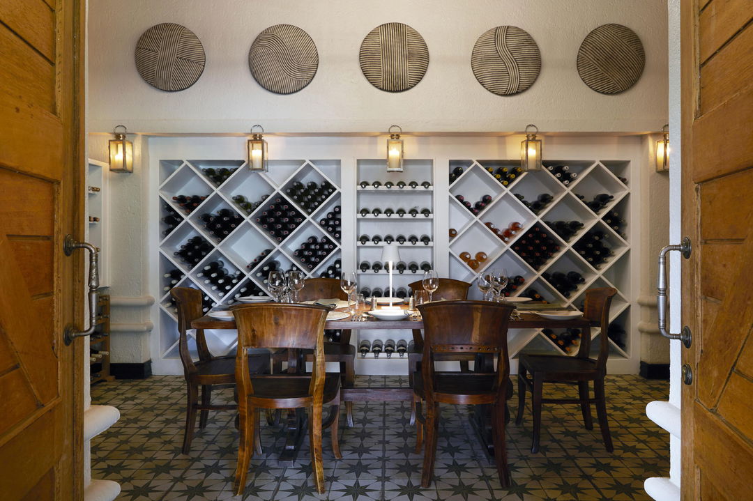 dinner setting in wine cellar of Narina lodge Lion Sands