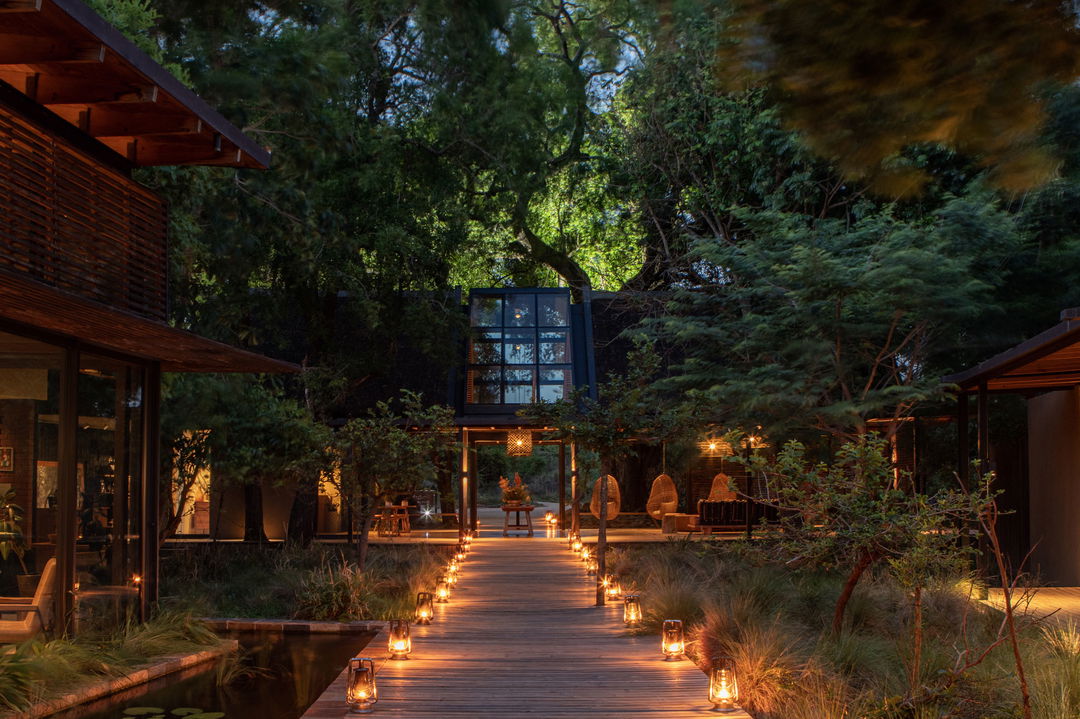 entrance of lion sands river lodge at night