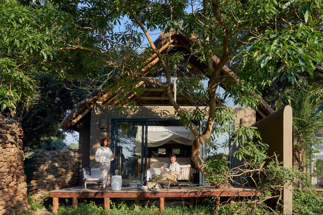 guests on deck of superior room of Tinga lodge Lion sands