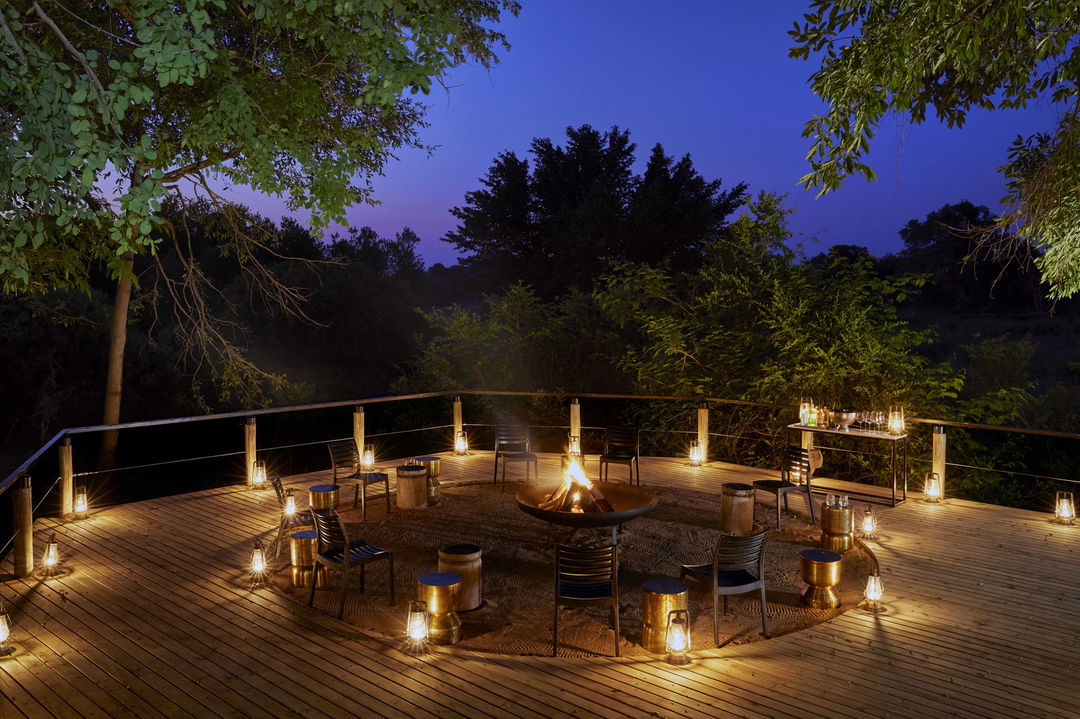 view of firedeck at night by Tinga lodge Lion sands